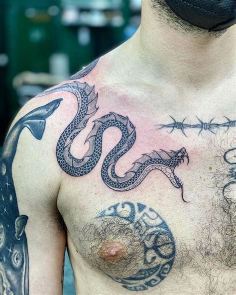 snake chest tattoo female.